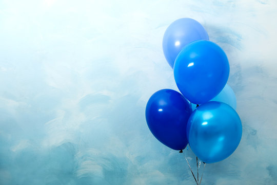 Bunch of balloons on light blue background, space for text. Greeting card