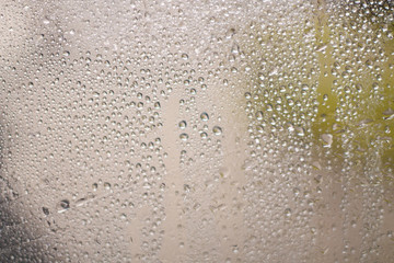 drops of autumn rain on the window macro
