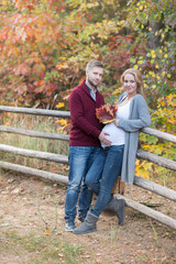 Fototapeta premium A portrait of young married couple expecting a baby