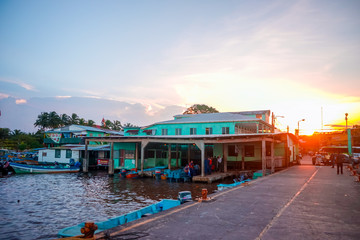 Sunset at the harbor. Unmatched magical fascinating landscape with boats in Bluefields nicaragua,...