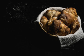 fresh cheese bread on black background and flour