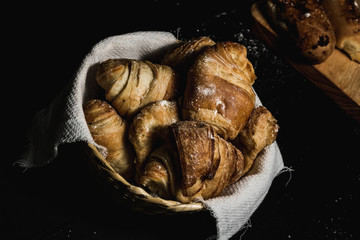 fresh cheese bread on black background and flour