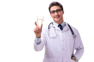 Young male doctor with calipers isolated on white