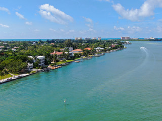 Fototapeta premium Aerial view of Bay Island neighborhood and luxury villas next the ocean, in Sarasota, Florida, USA
