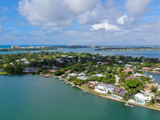 Fototapeta premium Aerial view of Bay Island neighborhood and luxury villas next the ocean, in Sarasota, Florida, USA