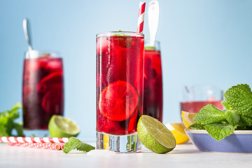Iced hibiscus tea (karkade, red sorrel, Agua de flor de Jamaica) or lemonade with raspberries,...