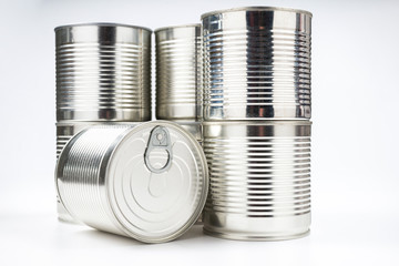 Group of silver canned food on white background.