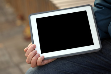 tablet in hands, on a blank screen place for text