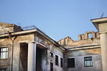 Demolished old soviet union building remains with column