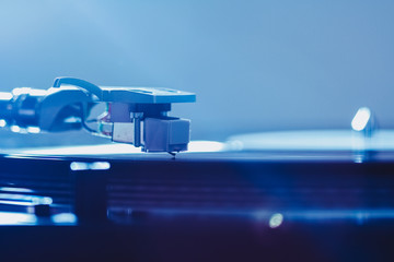 Close up of turntable needle on a vinyl record. Turntable playing vinyl.