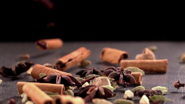 Falling Spices on Black Background Slow Motion