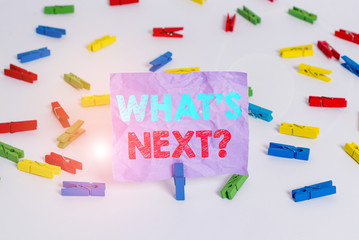 Writing note showing What S Next Question. Business concept for asking demonstrating about his coming actions or behaviors Colored clothespin papers empty reminder white floor background office