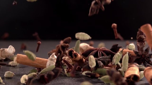 Falling Spices on Black Background Slow Motion