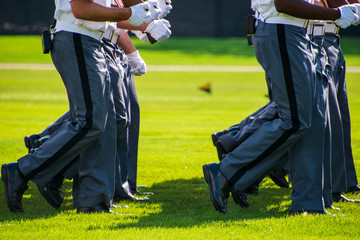 Lower body view of the gray uniform pants of Army cadets as they march