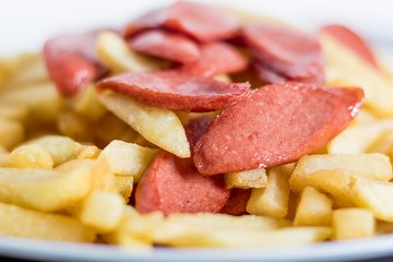 French fries with sausages with blur