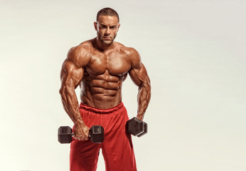Bodybuilder Exercise With Dumbbells. Studio Shot. Copy space