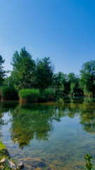 Fototapeta na wymiar Landscape with river and trees. Mreznica river near Duga Resa. Croatia.