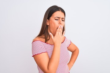 Portrait of beautiful young woman standing over isolated white background bored yawning tired covering mouth with hand. Restless and sleepiness.