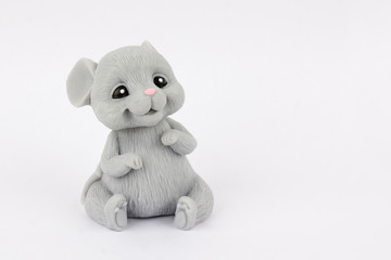 Mouse sitting on a white background. Handmade soap.