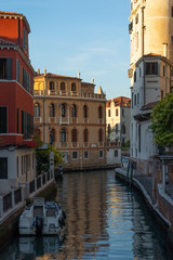 Old buildings in Venice. Canal view with boat. Travel photo. Italy. Europe.