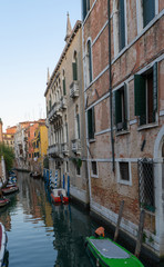 Fototapeta na wymiar Old buildings in Venice. Canal view with boat. Travel photo. Italy. Europe.