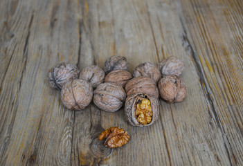 Walnuts closeup on a wooden background, selective focus