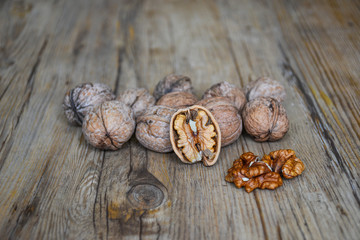 Walnuts closeup on a wooden background, selective focus