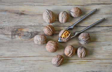 Walnuts closeup on a wooden background, selective focus