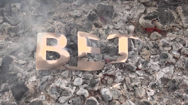 The concept of losing in a dispute or deal. The bet symbol burns in the fire. The end and destruction or the collapse and loss of hope in the bet.