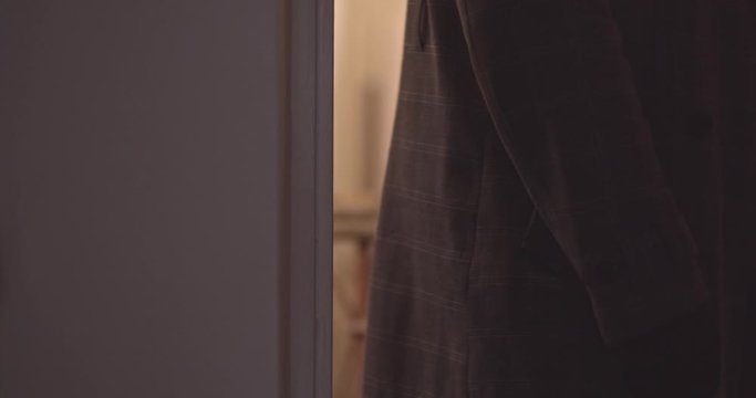 Male in black gloves enters the apartment. CSI.