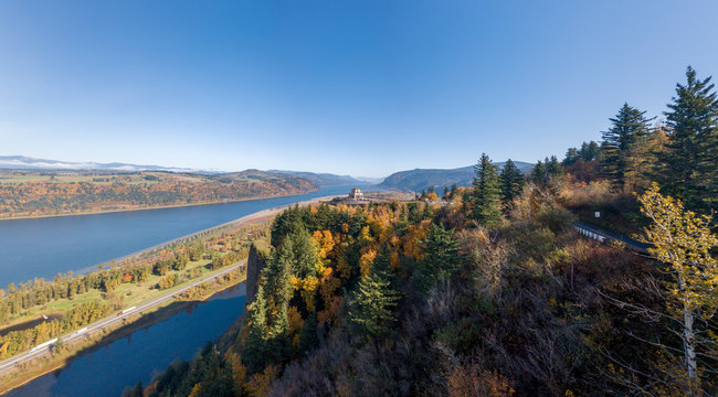 Panorama of Vista House at Crown Point in the Columbia River Gorge seen from Portland Women's Forum Scenic Viewpoint on a peaceful autumn day.