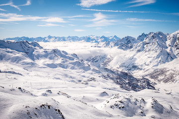 Fototapeta na wymiar Panoramic view at the ski slopes and Cervinia, Italy, Valle d'Aosta, Breuil-Cervinia, Aosta Valley, Cervinia