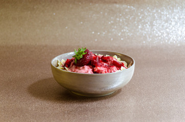 A bowl of strawberries with noodles