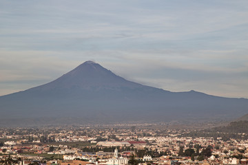 Panoramic view of the city, Popocatepetl volcano, San Gabriel Convent, the city is famous for its Great Pyramid, the largest archaeological site in the world at its base