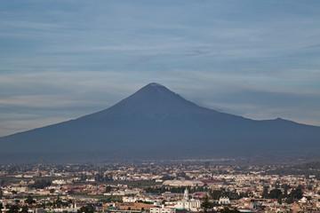 Panoramic view of the city, Popocatepetl volcano, San Gabriel Convent, the city is famous for its Great Pyramid, the largest archaeological site in the world at its base