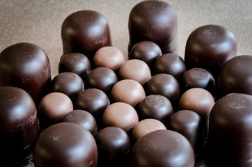 Black chocolate marshmallows in a group