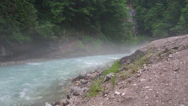 Flowing water in forest with foggy ambiance in Garmisch-Partenkirchen / Germany.