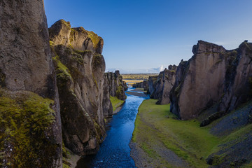 The most picturesque canyon Fjadrargljufur and the shallow creek, which flows along the bottom of the canyon. Fantastic country Iceland. September 2019. aerial drone shot