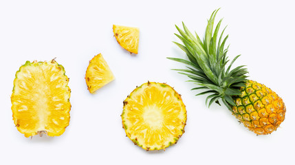 Fresh whole and cut pineapple isolated on white - obrazy, fototapety, plakaty