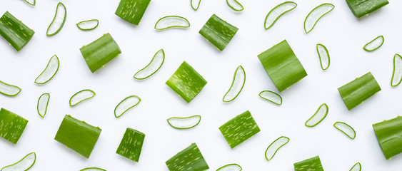 Aloe Vera leaves cut pieces with slices on white - obrazy, fototapety, plakaty