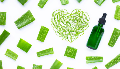 Essential oil with Aloe Vera leaves cut pieces with slices on white