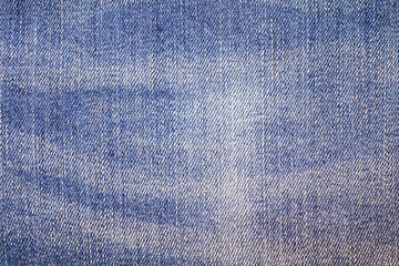 Fototapeta na wymiar Denim blue jeans background. Old classic faded blue color