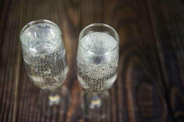 prosecco glass holiday drinks like themed party and holiday celebration concept with Champagne glasses for winter holidays decorated christmas on wooden table