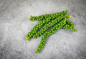 peppercorns on dark background - fresh green peppercorn seed for ingredients cuisine thai food...