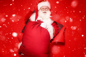 Santa Claus with the big gift box. © neonshot