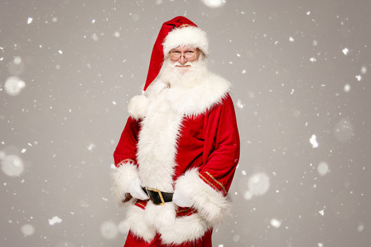 Real Santa Claus in red cap posing.