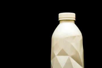 White plastic drinking water bottle on a black background