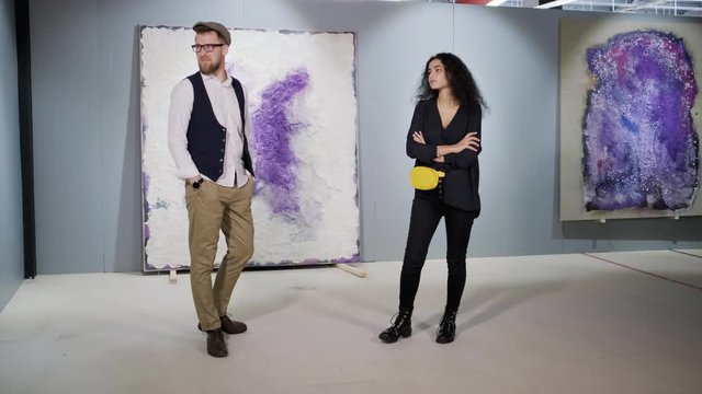 Art critics in picture gallery