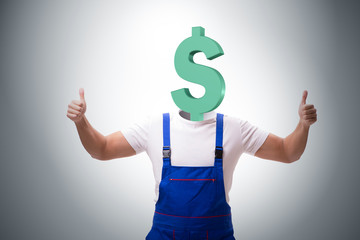 Worker with dollar head in business concept