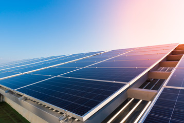 Solar panels and blue sky background.Solar cells farm on the roof.Photovoltaic modules for...